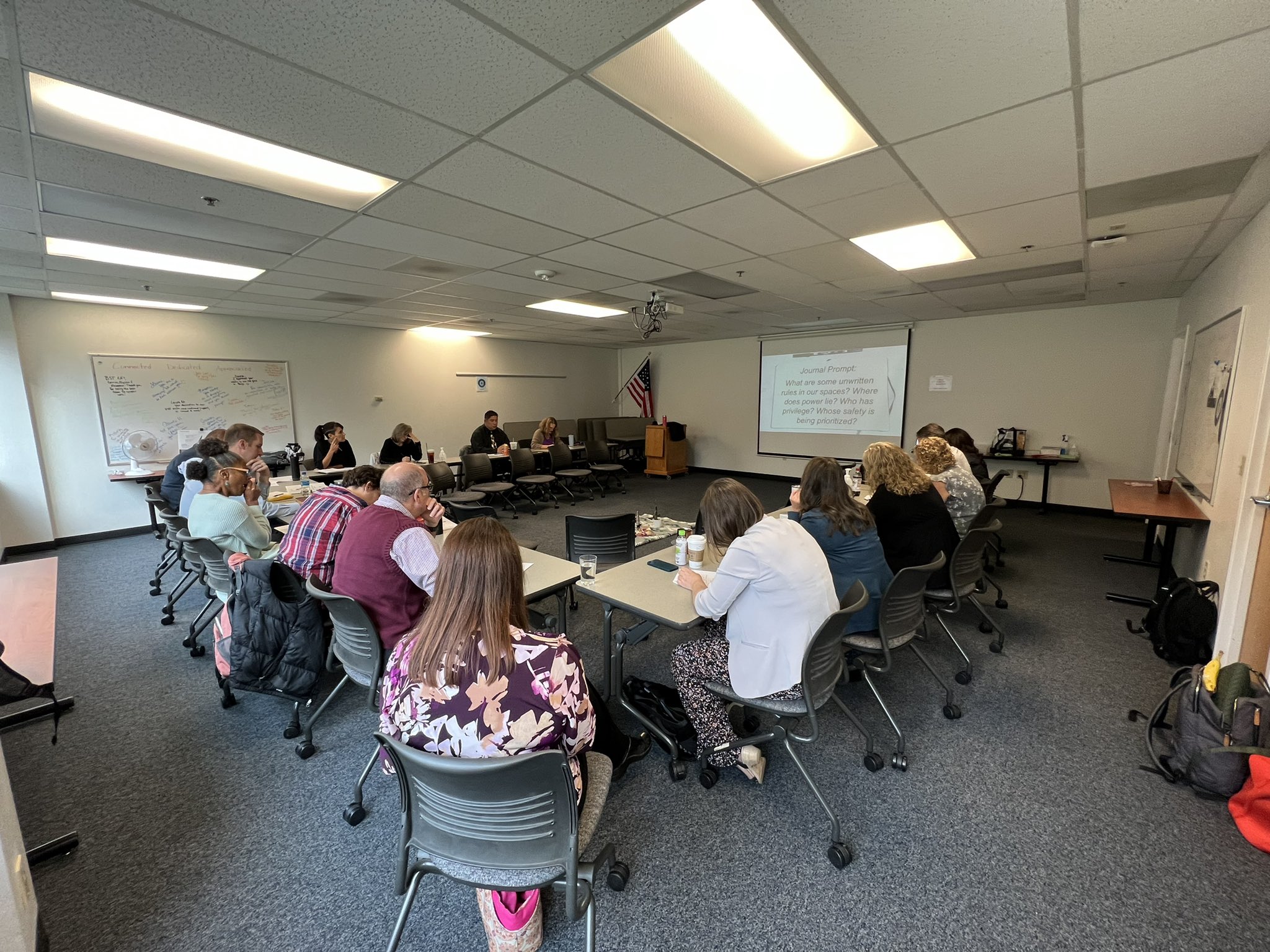 An educator workshop with educators sitting in a conference room.